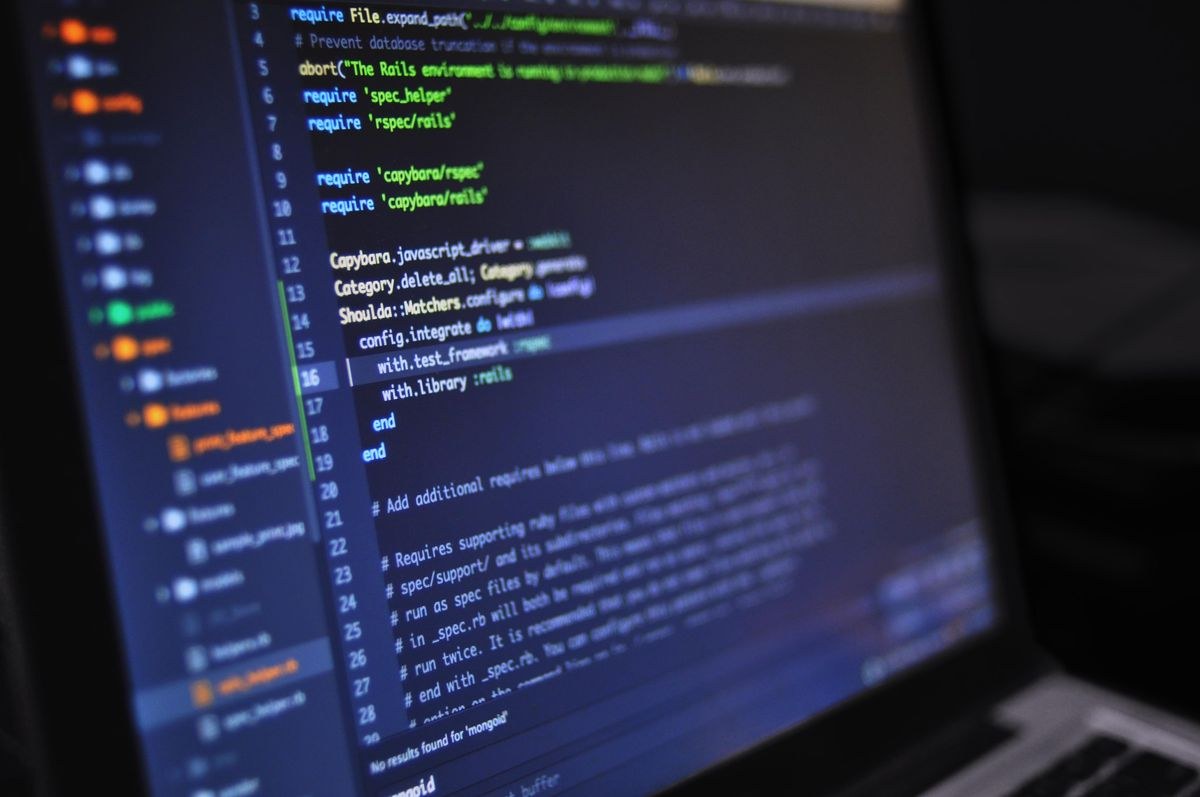 Close-up of a laptop screen showing lines of code in an editor